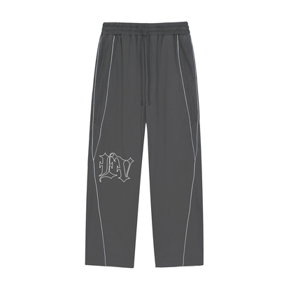 ODMPOD EVINCUS striped tracksuet pants with reflective detailing, featuring a comfortable fit and sporty design.